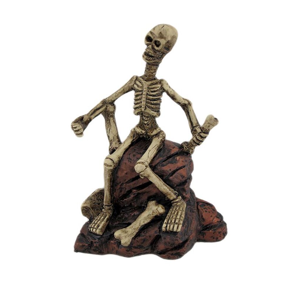 Creepy Skeleton Sitting On Rocks Statue Figure